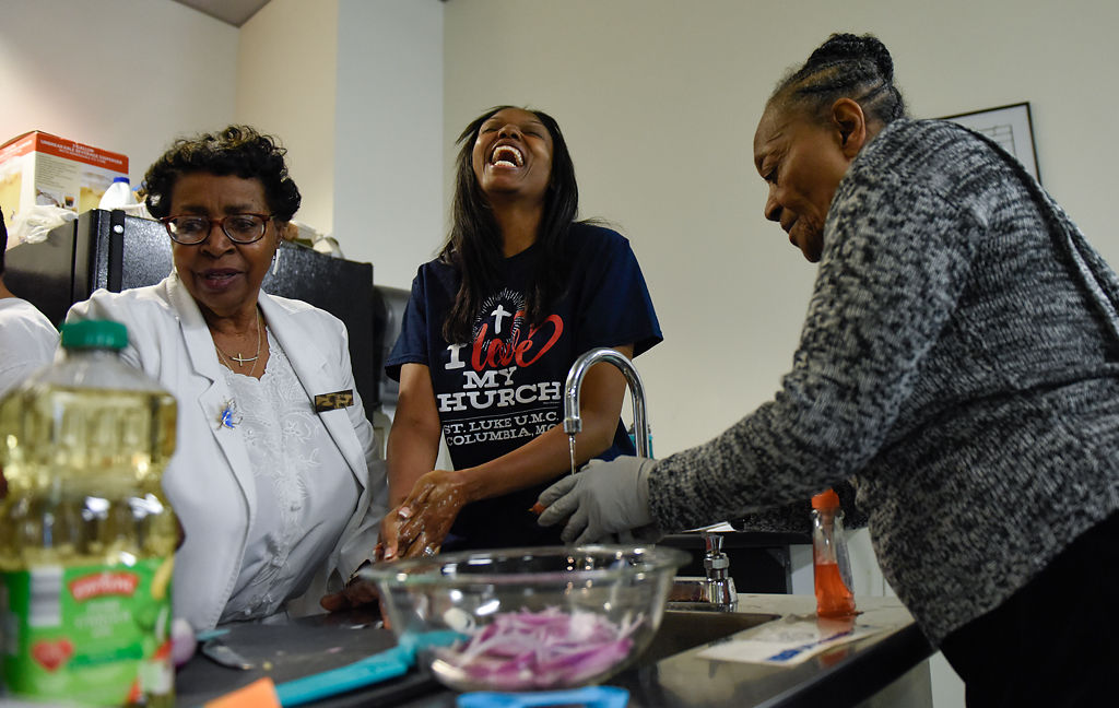 Frances Logan, Shae Brown, and Mary B. Warren wash their hands